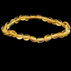 Bracelet bébé perles ovales en ambre miel