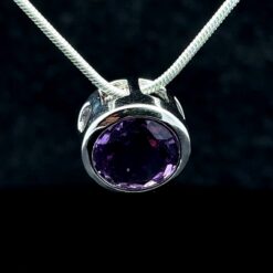 Faceted round amethyst and rhodium-plated silver pendant