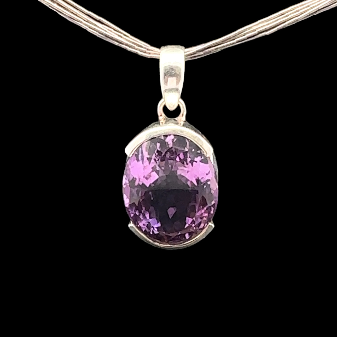 Oval faceted amethyst and silver pendant 20 x 15 mm