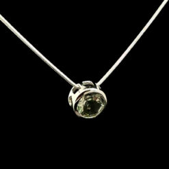 Round faceted prasiolite and rhodium-plated silver pendant