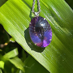 Faceted amethyst and silver oval pendant