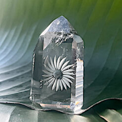 Carved rock crystal point - unique flower motif