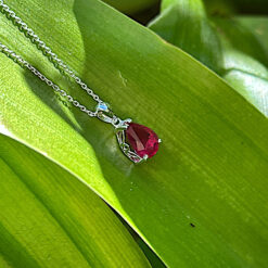 Faceted ruby and silver pendant
