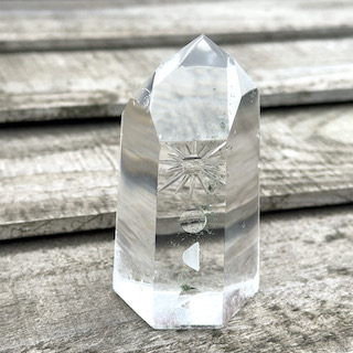 Engraved rock crystal point - sun and moon motif