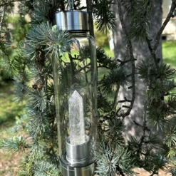 Water bottle with clear quartz crystal point